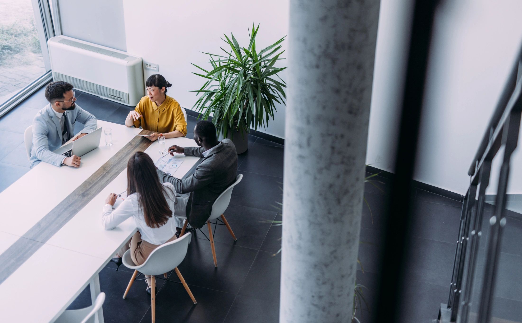 Logistics software team collaborating in an office meeting